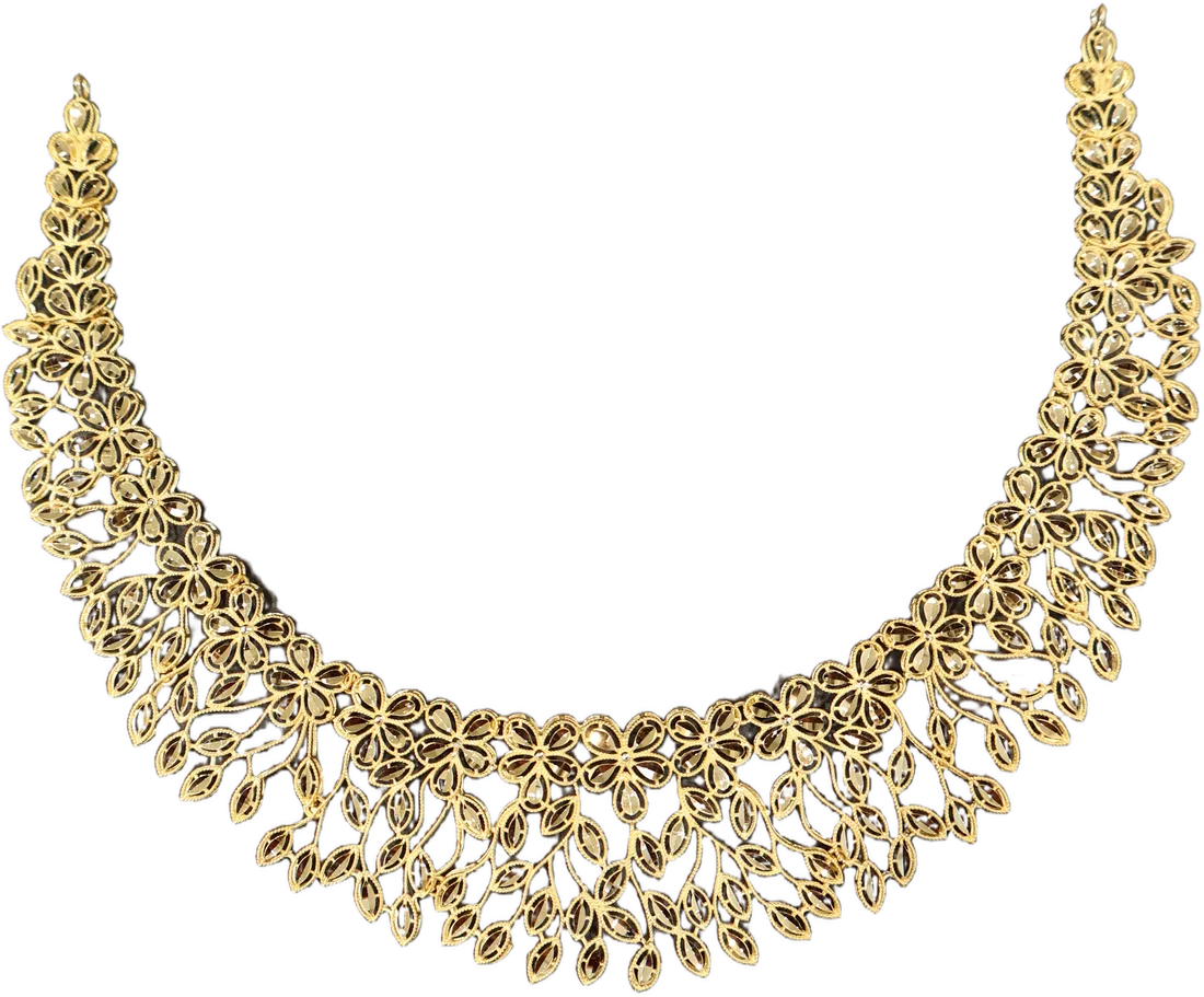 A filigree collar necklace of flowers and leaves