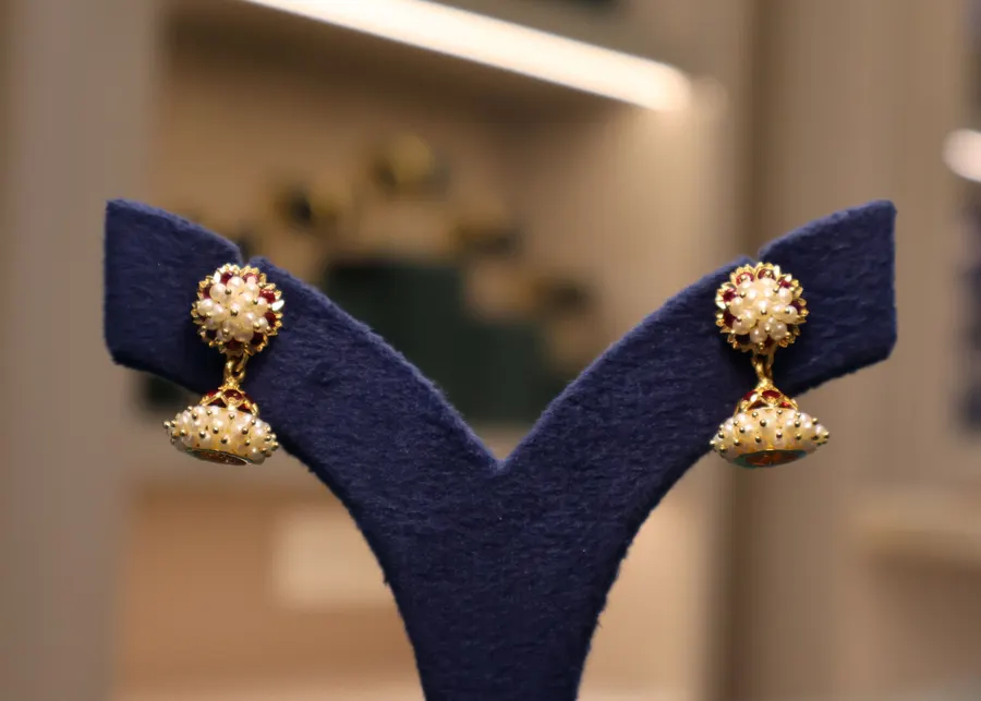 Gold drop earrings with red stones, on our Instagram